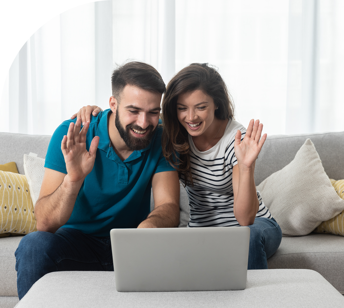 Couple waving during a video call.